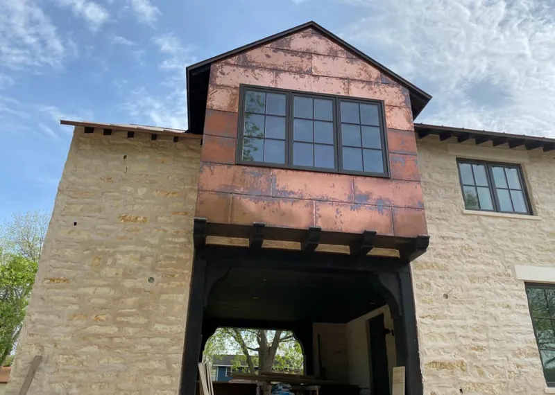 Copper metal panel facade on a stone building for Metal Roof Coating in Peoria